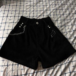 Small back high waisted shorts with silver accessories on it